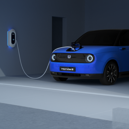 Vue de trois-quarts avant de la Honda Urban EV Concept avec borne de charge.