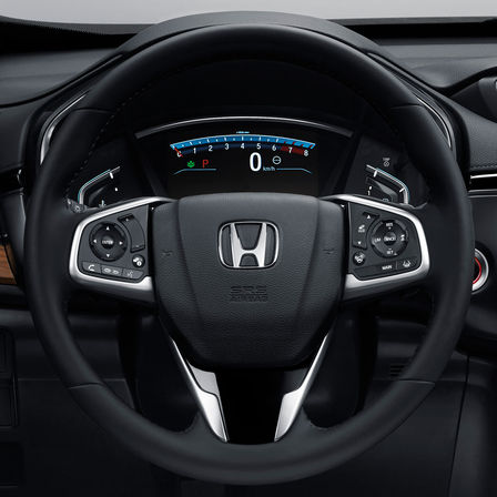 Gros plan du volant multi-fonctions du Honda CR-V.