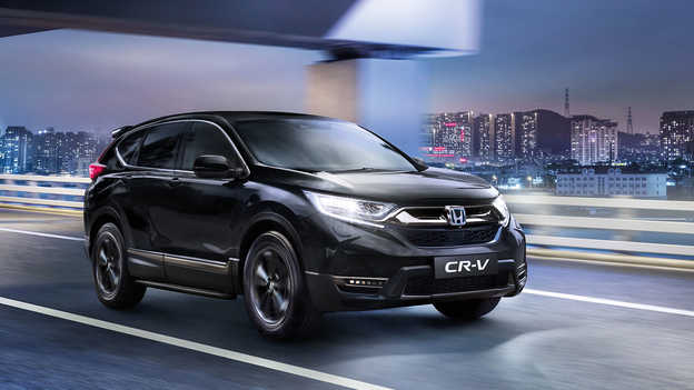 Application My Honda sur un téléphone tenu dans une main