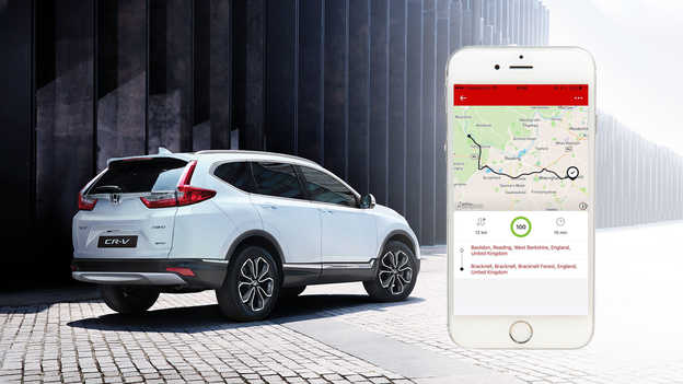 Application My Honda sur un téléphone tenu dans une main