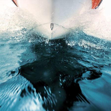 Close up of clear water with Honda engine.