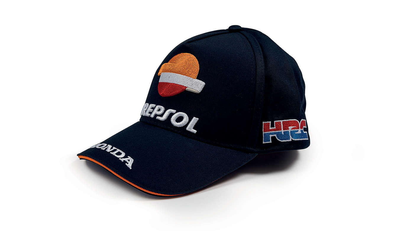 Casquette bleue aux couleurs de l’équipe Honda MotoGP et logo Repsol.