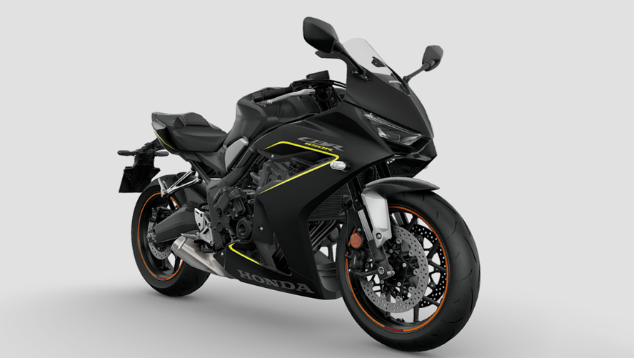 A sleek black Honda CBR650R sport motorcycle with yellow accents, featuring aerodynamic fairings, dual front disc brakes, and a sporty riding position.