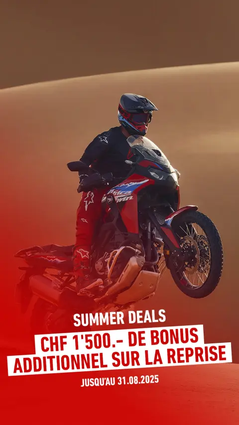Mannequin sur une moto CRF1100L Africa Twin dans un environnement désertique.